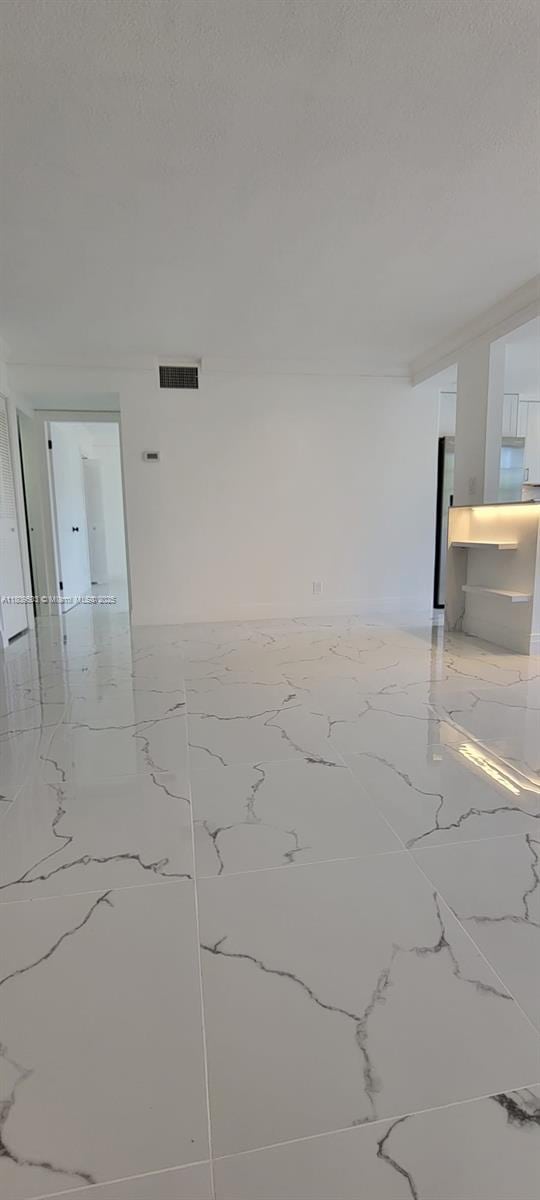 2301 NW 41st Ave Unit 209, Lauderhill, FL 33313 - empty room with marble tiled flooring