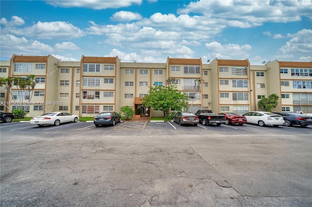 2301 NW 41st Ave Unit 209, Lauderhill, FL 33313 - view of apartment building / complex featuring uncovered parking