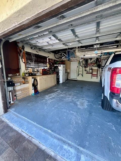 13090 Biscayne Bay Ter, North Miami, FL 33181 - garage featuring freestanding refrigerator