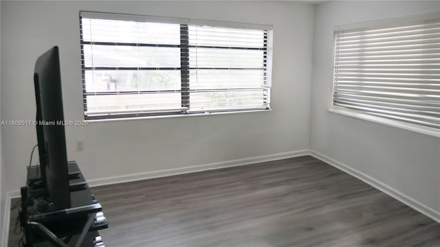 1930 NW 55th St, Miami, FL 33142 - unfurnished room featuring dark wood-style floors and baseboards