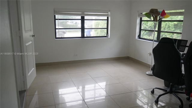 1930 NW 55th St, Miami, FL 33142 - unfurnished office with baseboards and light tile patterned flooring