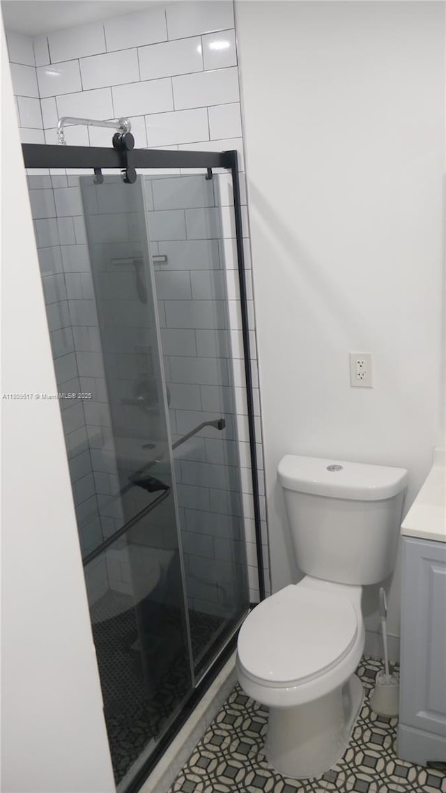 1930 NW 55th St, Miami, FL 33142 - full bathroom with a shower stall, toilet, vanity, and tile patterned flooring