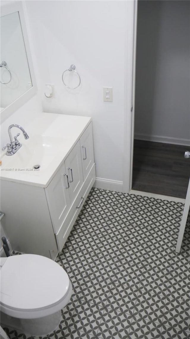 1930 NW 55th St, Miami, FL 33142 - half bath featuring vanity, baseboards, and toilet