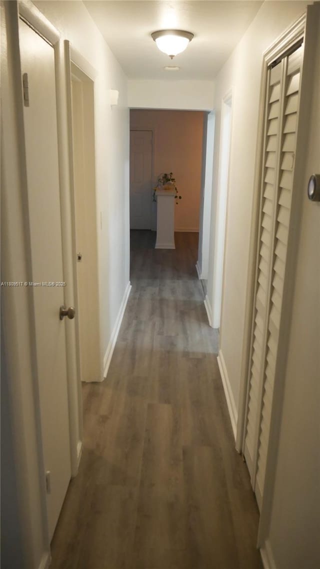 1930 NW 55th St, Miami, FL 33142 - hall featuring wood finished floors and baseboards
