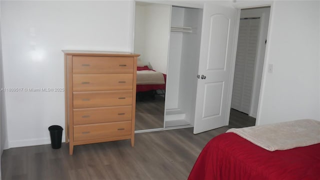 1930 NW 55th St, Miami, FL 33142 - bedroom featuring dark wood finished floors, a closet, and baseboards