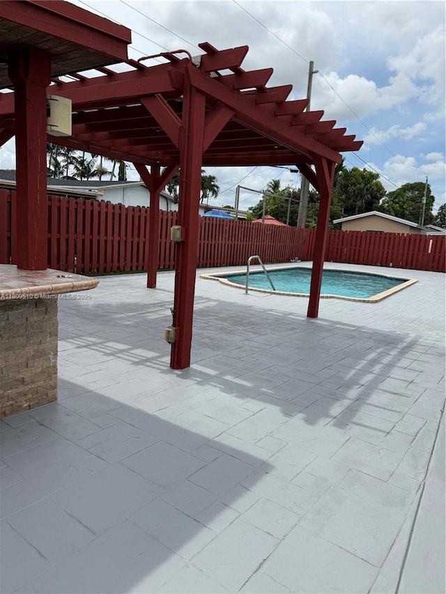 6561 W 13th Ct, Hialeah, FL 33012 - view of swimming pool with a pergola, a patio, and a fenced backyard