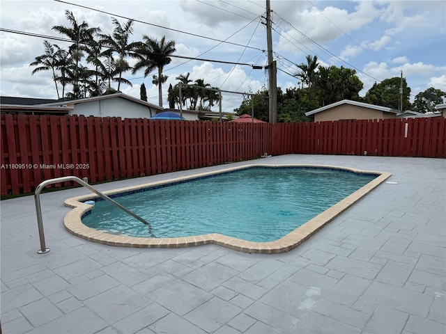 6561 W 13th Ct, Hialeah, FL 33012 - view of swimming pool featuring a fenced backyard and a patio area