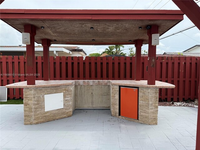 6561 W 13th Ct, Hialeah, FL 33012 - view of patio featuring an outdoor kitchen