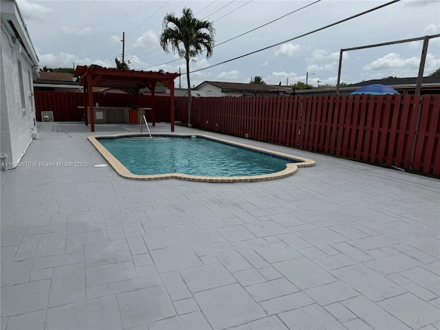 6561 W 13th Ct, Hialeah, FL 33012 - view of swimming pool with a pergola, a patio, and a fenced backyard