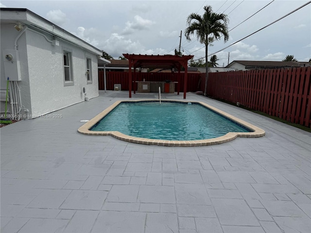 6561 W 13th Ct, Hialeah, FL 33012 - view of pool with a pergola, a fenced backyard, and a patio