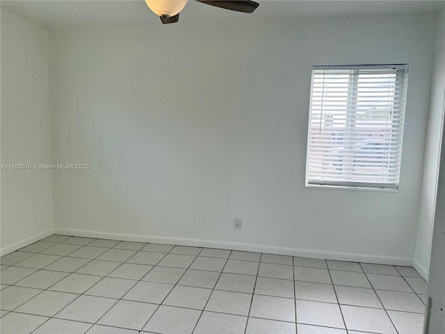 6561 W 13th Ct, Hialeah, FL 33012 - unfurnished room with a ceiling fan, light tile patterned floors, and baseboards