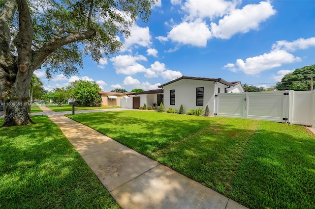 9241 SW 55th St, Cooper City, FL 33328 - view of yard featuring a gate, driveway, and a garage