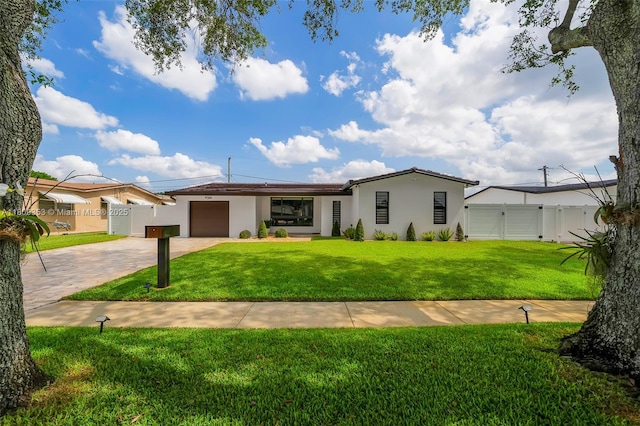 9241 SW 55th St, Cooper City, FL 33328 - ranch-style house featuring a garage, stucco siding, concrete driveway, and a gate