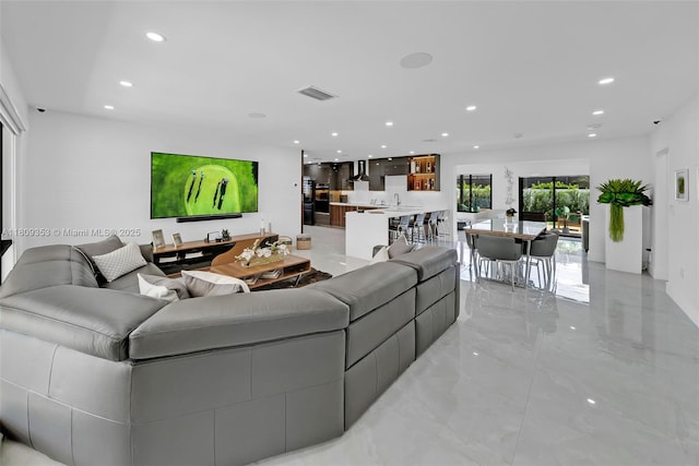 9241 SW 55th St, Cooper City, FL 33328 - living room featuring recessed lighting and light marble finish flooring
