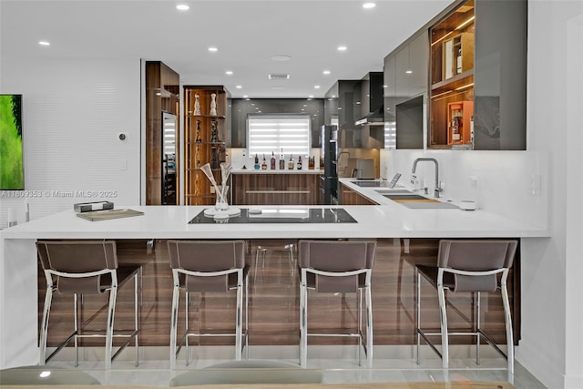 9241 SW 55th St, Cooper City, FL 33328 - kitchen with modern cabinets, a sink, a peninsula, light countertops, and recessed lighting