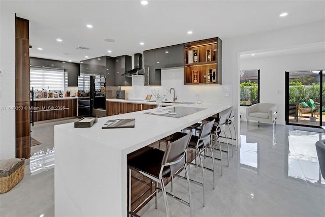 9241 SW 55th St, Cooper City, FL 33328 - kitchen featuring modern cabinets, wall chimney exhaust hood, plenty of natural light, a kitchen breakfast bar, and recessed lighting