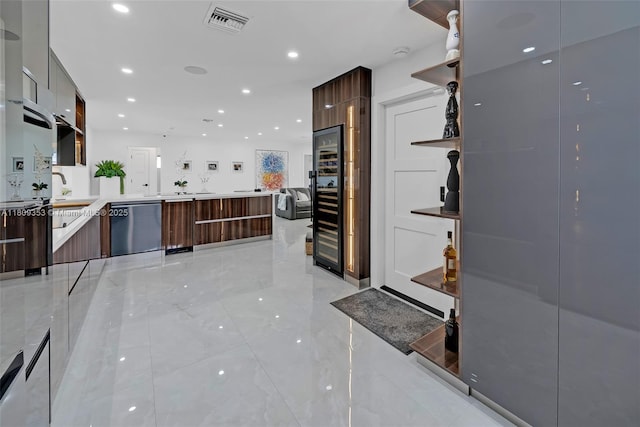 9241 SW 55th St, Cooper City, FL 33328 - kitchen featuring modern cabinets, stainless steel dishwasher, a peninsula, open floor plan, and light countertops
