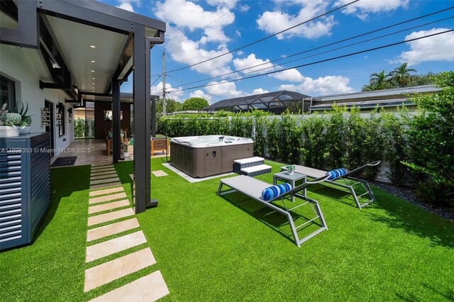 9241 SW 55th St, Cooper City, FL 33328 - view of green lawn featuring a hot tub and a patio area