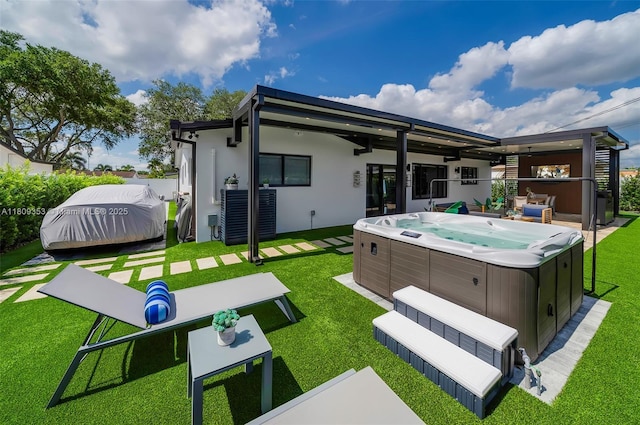 9241 SW 55th St, Cooper City, FL 33328 - back of house featuring a hot tub and a yard