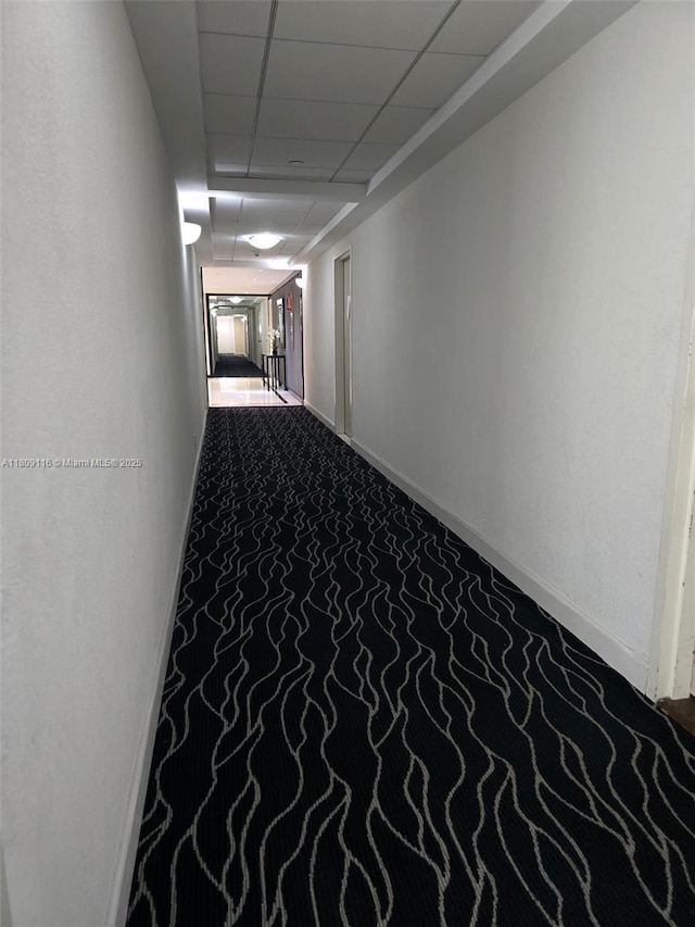 200 SE 15th Rd Unit 6B, Miami, FL 33129 - hallway featuring a paneled ceiling and baseboards
