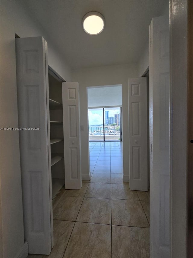 200 SE 15th Rd Unit 6B, Miami, FL 33129 - hall with light tile patterned flooring and baseboards
