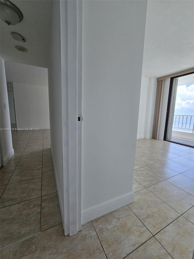 200 SE 15th Rd Unit 6B, Miami, FL 33129 - corridor featuring tile patterned floors and baseboards