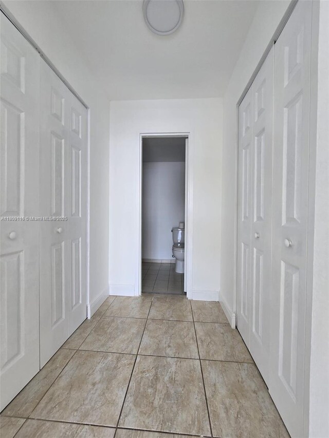 200 SE 15th Rd Unit 6B, Miami, FL 33129 - hallway featuring baseboards and tile patterned floors