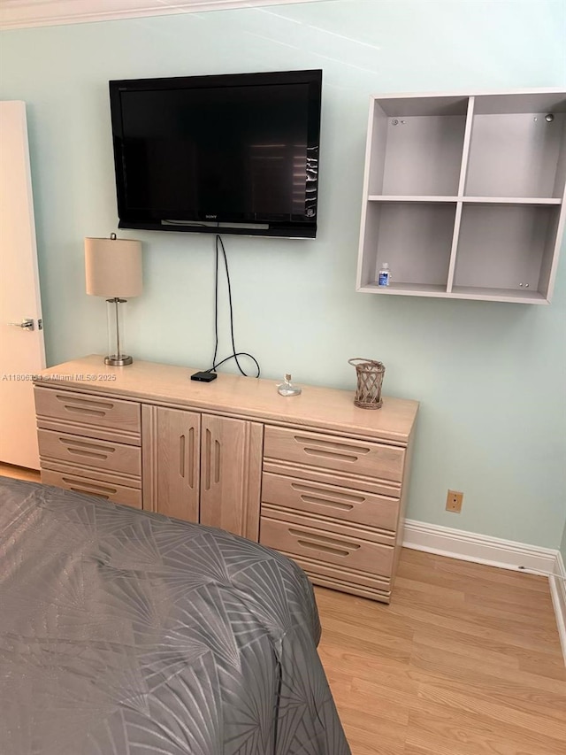 7680 NW 1st St Unit 108, Margate, FL 33063 - bedroom featuring baseboards and light wood-type flooring