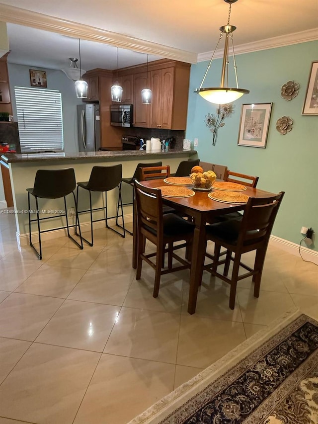 7680 NW 1st St Unit 108, Margate, FL 33063 - dining area with ornamental molding, light tile patterned flooring, and baseboards