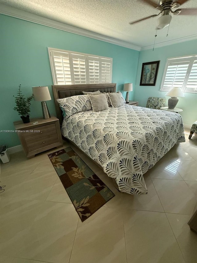 7680 NW 1st St Unit 108, Margate, FL 33063 - bedroom with ornamental molding, tile patterned flooring, ceiling fan, and a textured ceiling