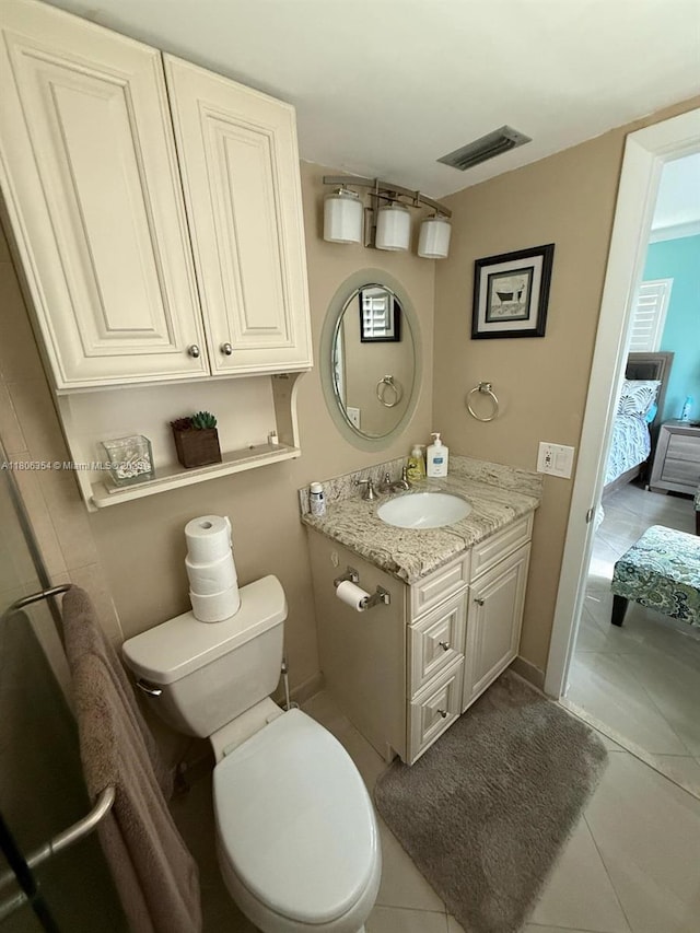 7680 NW 1st St Unit 108, Margate, FL 33063 - ensuite bathroom with vanity, tile patterned floors, and toilet