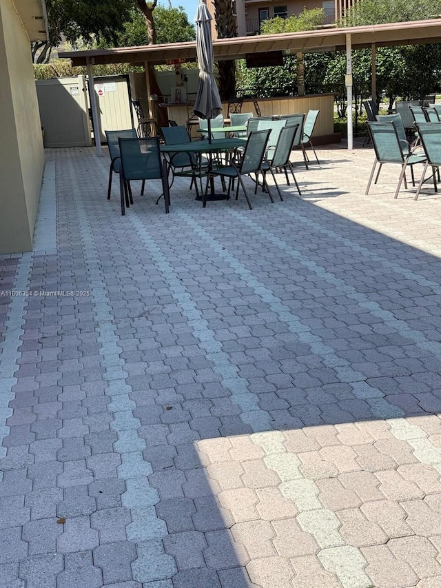 7680 NW 1st St Unit 108, Margate, FL 33063 - view of patio with outdoor dining space