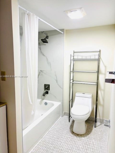 210 174th St Unit 818, Sunny Isles Beach, FL 33160 - bathroom with toilet, shower / bath combo, tile patterned floors, and baseboards