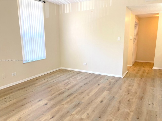 3660 Inverrary Dr Unit 2X, Lauderhill, FL 33319 - empty room featuring wood finished floors and baseboards