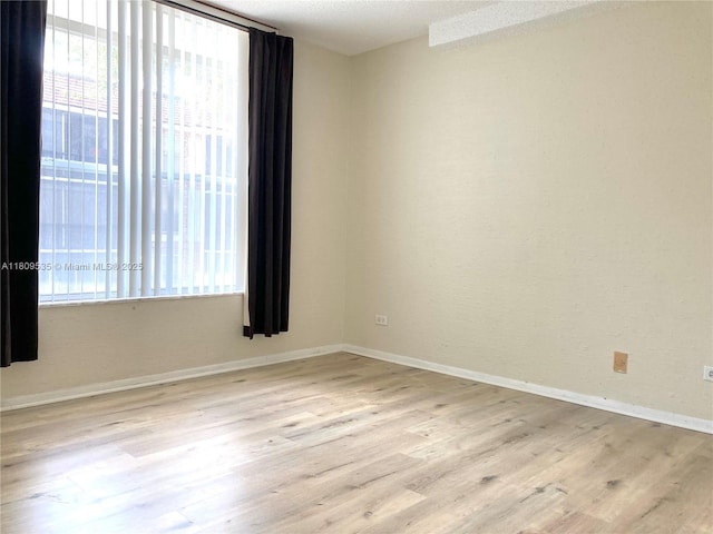 3660 Inverrary Dr Unit 2X, Lauderhill, FL 33319 - empty room with wood finished floors and baseboards
