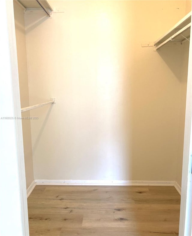 3660 Inverrary Dr Unit 2X, Lauderhill, FL 33319 - spacious closet with wood finished floors