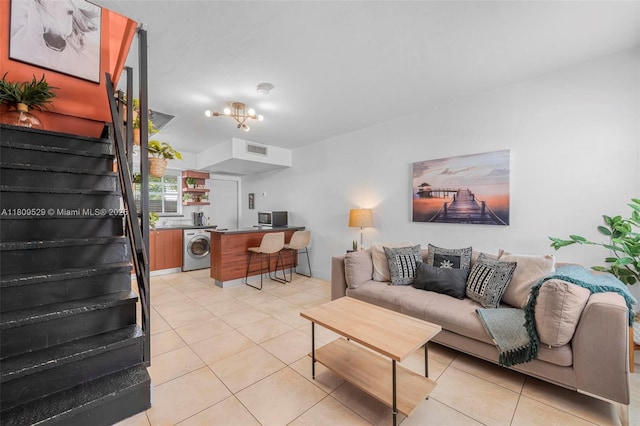 938 SW 6th St Unit 8, Miami, FL 33130 - living room featuring washer / dryer and light tile patterned flooring