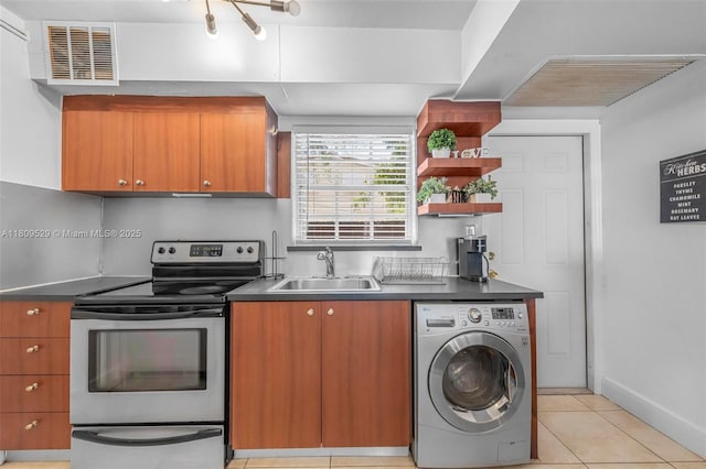 938 SW 6th St Unit 8, Miami, FL 33130 - kitchen with washer / clothes dryer, electric stove, a sink, and brown cabinetry