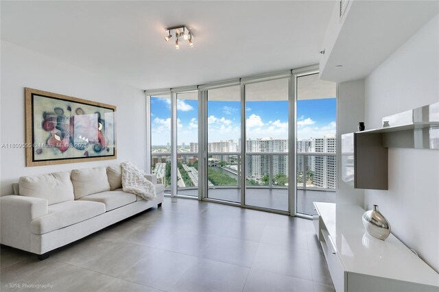 17201 Collins Ave Unit 2006, Sunny Isles Beach, FL 33160 - living area with a wall of windows, a city view, and light tile patterned flooring