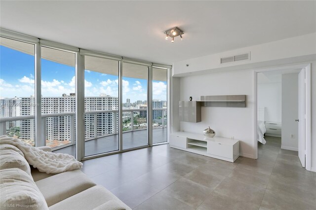 17201 Collins Ave Unit 2006, Sunny Isles Beach, FL 33160 - living area with a view of city, a wall of windows, and baseboards