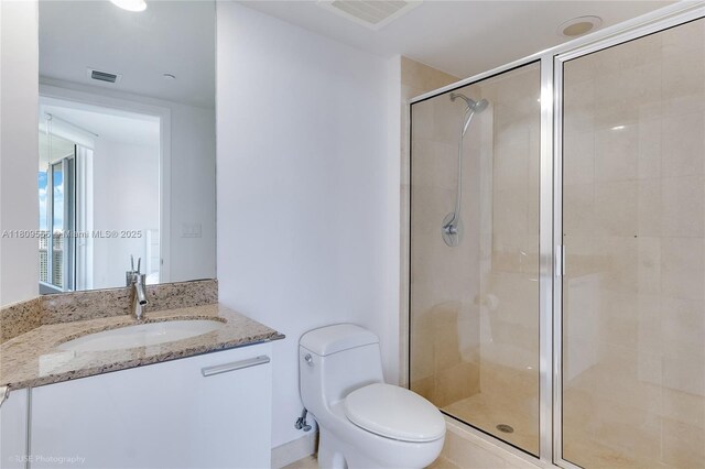 17201 Collins Ave Unit 2006, Sunny Isles Beach, FL 33160 - full bathroom featuring vanity, toilet, and a stall shower