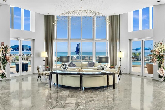 17201 Collins Ave Unit 2006, Sunny Isles Beach, FL 33160 - living area featuring a high ceiling, french doors, and marble tiled floors