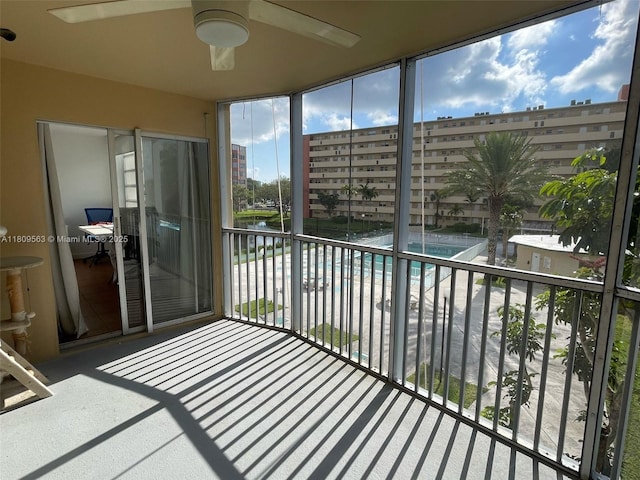 1770 NE 191st St Unit 316-1, Miami, FL 33179 - unfurnished sunroom featuring ceiling fan and a city view