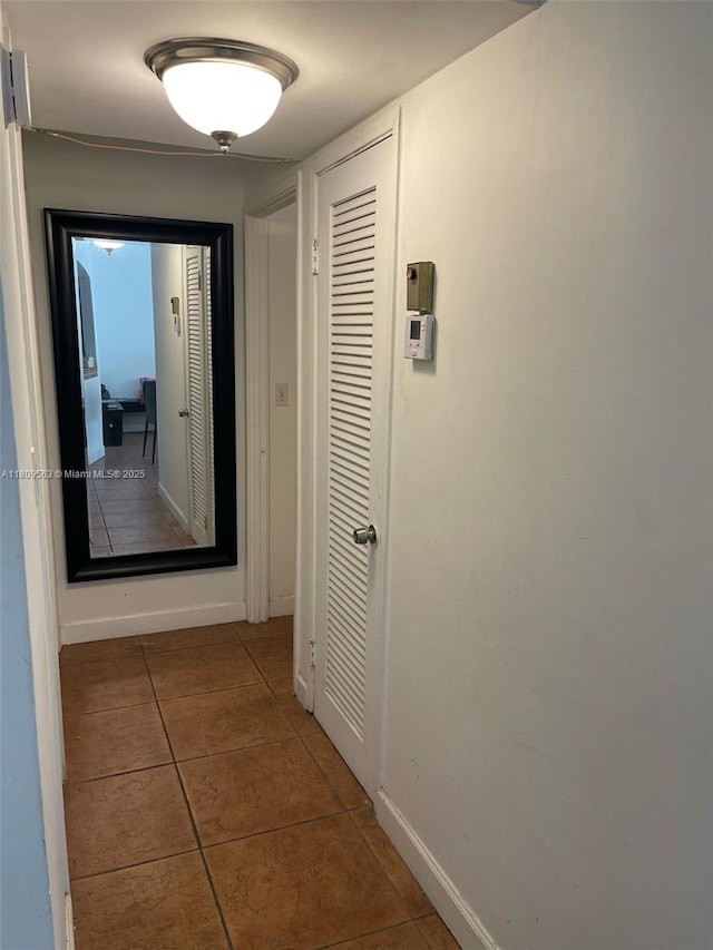 1770 NE 191st St Unit 316-1, Miami, FL 33179 - hall with tile patterned floors and baseboards