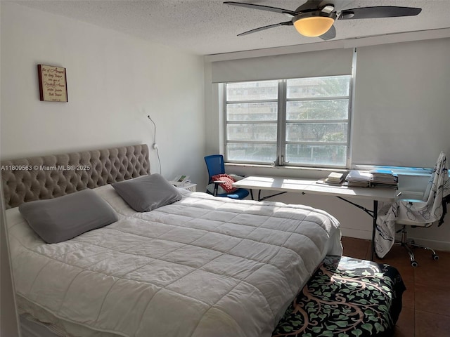 1770 NE 191st St Unit 316-1, Miami, FL 33179 - tiled bedroom with a textured ceiling and a ceiling fan