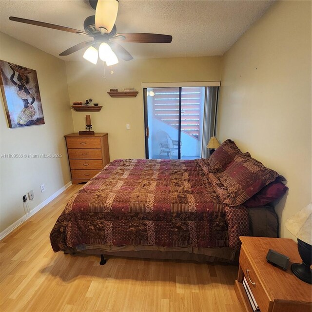 5542 Courtyard Dr Unit 5542, Margate, FL 33063 - bedroom with wood finished floors, ceiling fan, and a textured ceiling