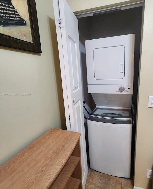 5542 Courtyard Dr Unit 5542, Margate, FL 33063 - laundry area with stacked washer and clothes dryer and tile patterned floors