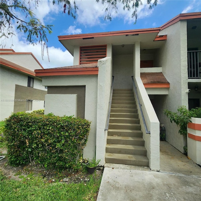 5542 Courtyard Dr Unit 5542, Margate, FL 33063 - view of exterior entry featuring stucco siding