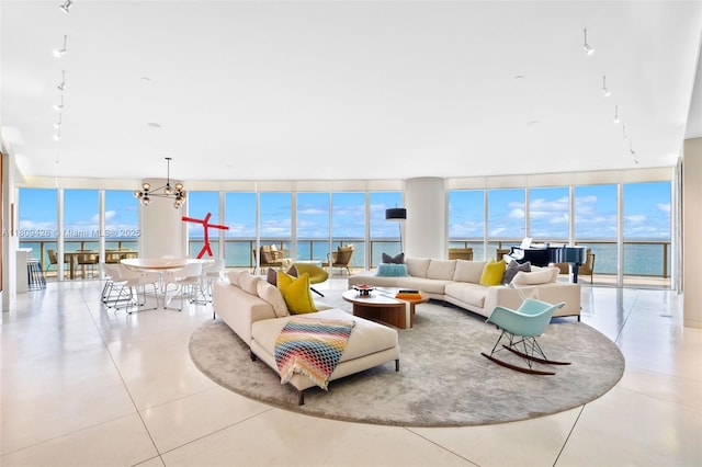 9703 Collins Ave Unit 1700, Bal Harbour, FL 33154 - tiled living room featuring expansive windows and a chandelier