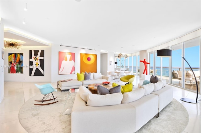 9703 Collins Ave Unit 1700, Bal Harbour, FL 33154 - living room featuring tile patterned flooring, a chandelier, and expansive windows